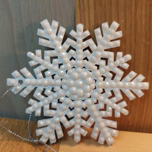 Blinged out wooden snowflake ornament
